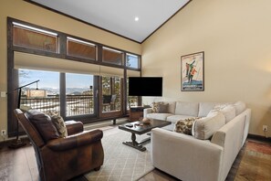 Open concept kitchen, dining and living areas.