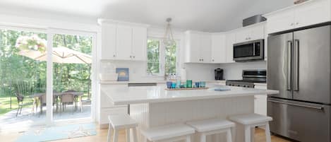 Large fully stocked open and bright kitchen