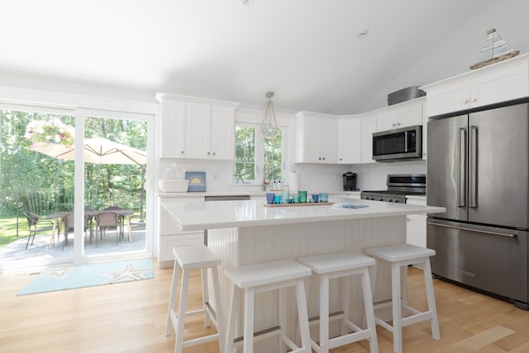 Large fully stocked open and bright kitchen