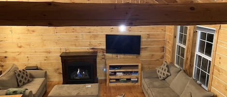 Living space: two couches and a loveseat, gas fireplace, 55" smart tv, games