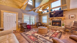 The cozy remote-control gas fireplace creates a cozy ambiance