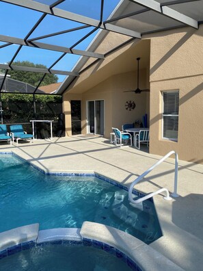 Beautiful pool area. Lanai with table and chairs. Plenty of loungers.  