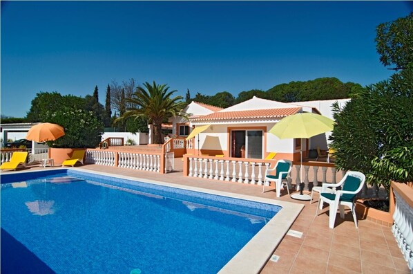 Fenced pool area with private pool and adjoining terrace