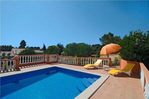 Private fenced pool area with wrap-around terrace
