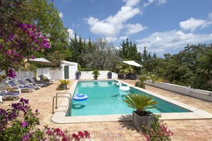 Pool with sun loungers