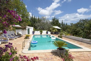 Pool with sun loungers