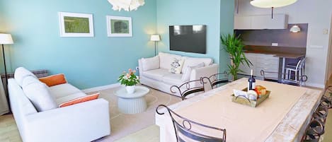Living room with two sosfas and a large dining table