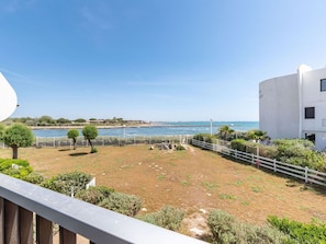 Sky, Water, Plant, Natural Environment, Land Lot, Coastal And Oceanic Landforms, Urban Design, Shade, Grass, Fence