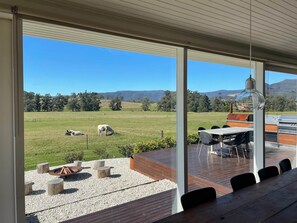 View out to deck, BBQ, smoker and firepit