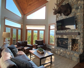 Living Room with river rock wood fireplace