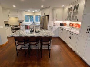 Renovated kitchen with breakfast bar for 3