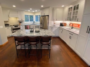 Renovated kitchen with breakfast bar for 3