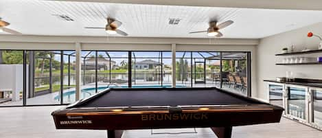 Billiard table with view to pool deck