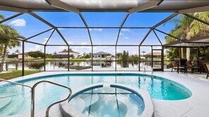 Electric heated pool and spa overlooking the canal