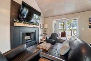 Open concept living room dining kitchen. Wood burning fireplace. Wood provided