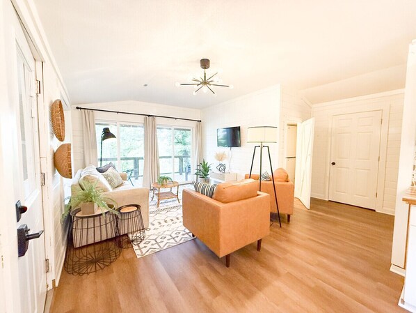 The living area is on the upper level with plenty of natural light.