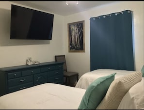 Two Twin Bedroom with large closet and dresser and 55 inch Smart TV