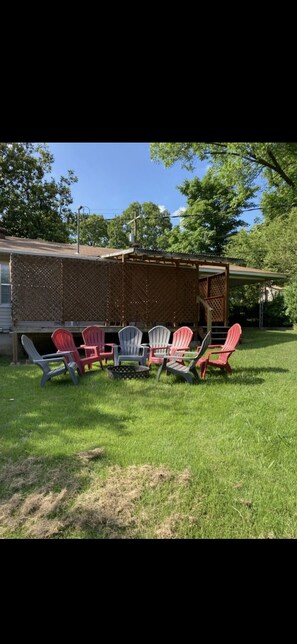 Fire pit in the backyard with plenty of seating for everyone