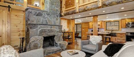 The large, stone fireplace is the centerpiece of the Great Room. 