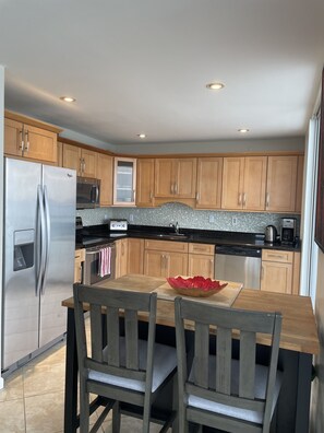 Kitchen opens to balcony and living area