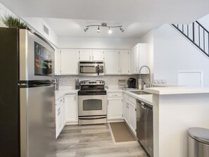 Prepare your favorite meals in the spacious, fully equipped kitchen.
