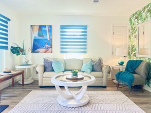 Bright living room with sofa bed.