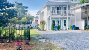 Large parking fits 3 cars; large corner lot lawn.