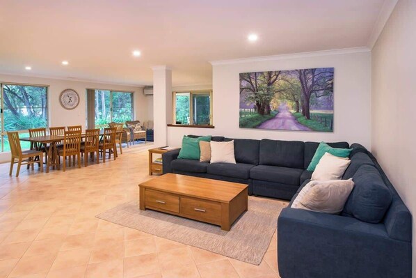 A large communal space encompasses the main lounge, dining area, kitchen and games room, making it easy to spend quality time together