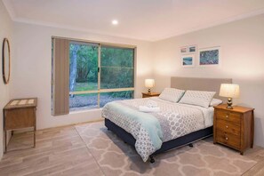 The master bedroom looks onto the private back yard