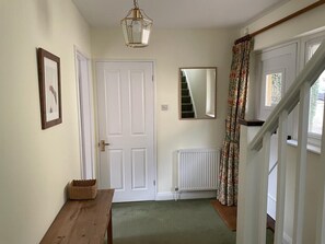 Entrance hall, with cloakroom (w.c. and washbasin)