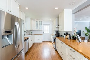 Fully stocked kitchen with stainless steel appliances