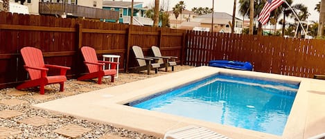 spacious outdoor area with a pool.