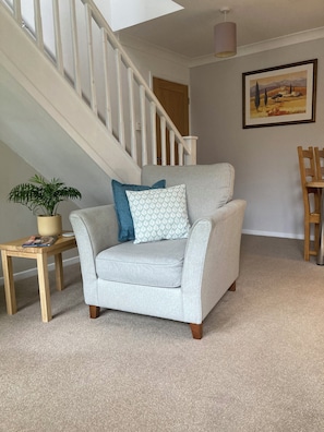 Open plan area with comfortable seating and dining table.