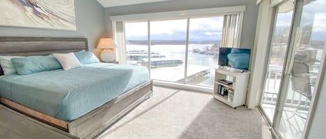 Master bedroom with lakeside views and king bed