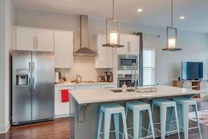 The kitchen island has plenty of space for enjoying your favorite meals. 