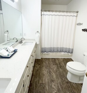 Master bathroom with new luxury quartz countertop, designer sinks and faucets