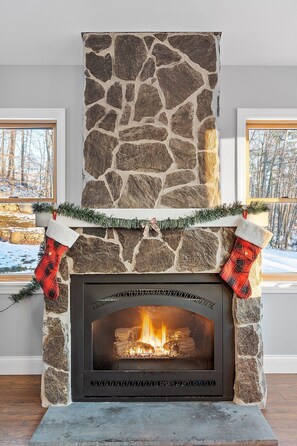 Sitting room, gas fueled fire place provides a cozy and quiet place for reading.