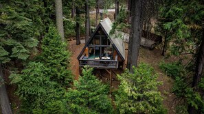 Stunning aerial view of Sway Chalet, featuring a spacious deck perfect for relaxation and outdoor gatherings.