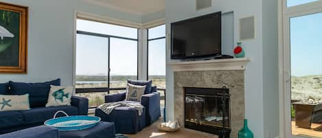 Living room with ocean, river and valley views toward Monterey.