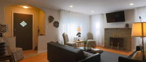 Pictured here is a bright and spacious living room area with plenty of seating for everyone!