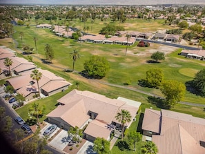 Overview of home and location on golf course with mountain view.