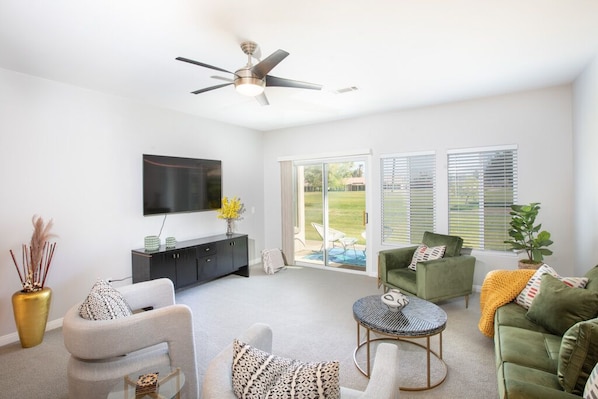 Living room area looking out onto golf course in rear.