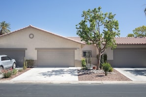 Front of condo with 2-car garage.