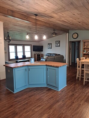 Kitchen looking into living room and dining room