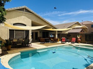 BBQ, smoker, & outdoor furniture to enjoy the private backyard in sun & shade