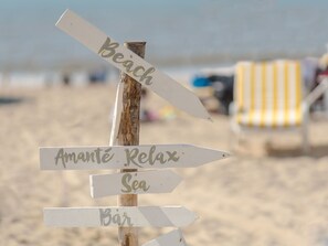 Natural Environment, Wood, Sky, Font, Landscape, Grass, Sand, Shore, Event