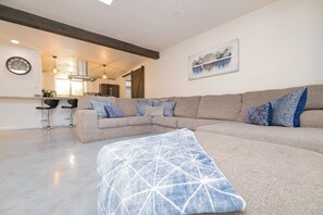 Relax on the big comfy sectional in the living room