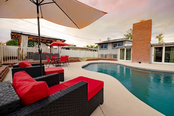 Take a dip in the pool, enjoy the shaded seating under the pergola and catch an amazing sunset by the outdoor fire pit