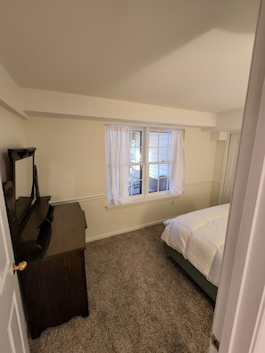 Dresser with mirror in the bedroom.