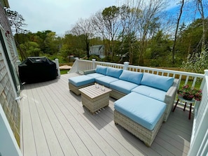 Deck with wicker furniture and grill